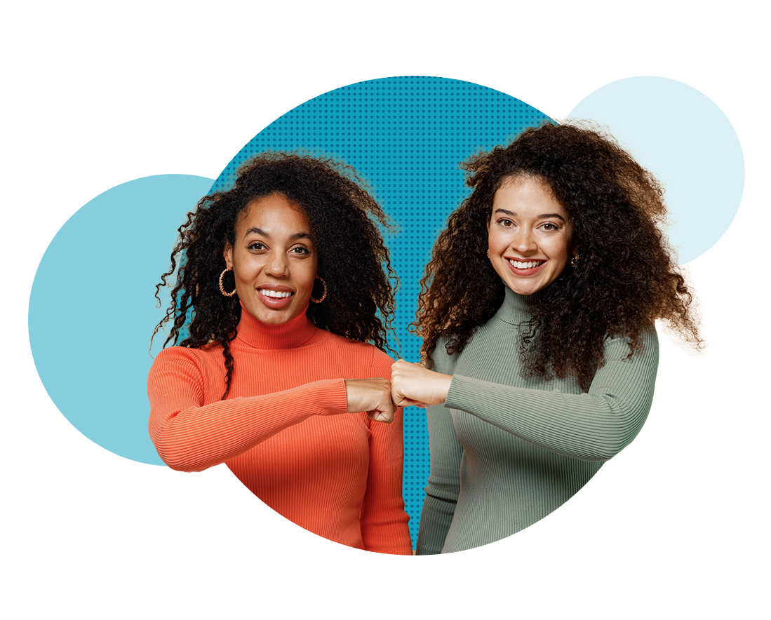 two women fist bumping